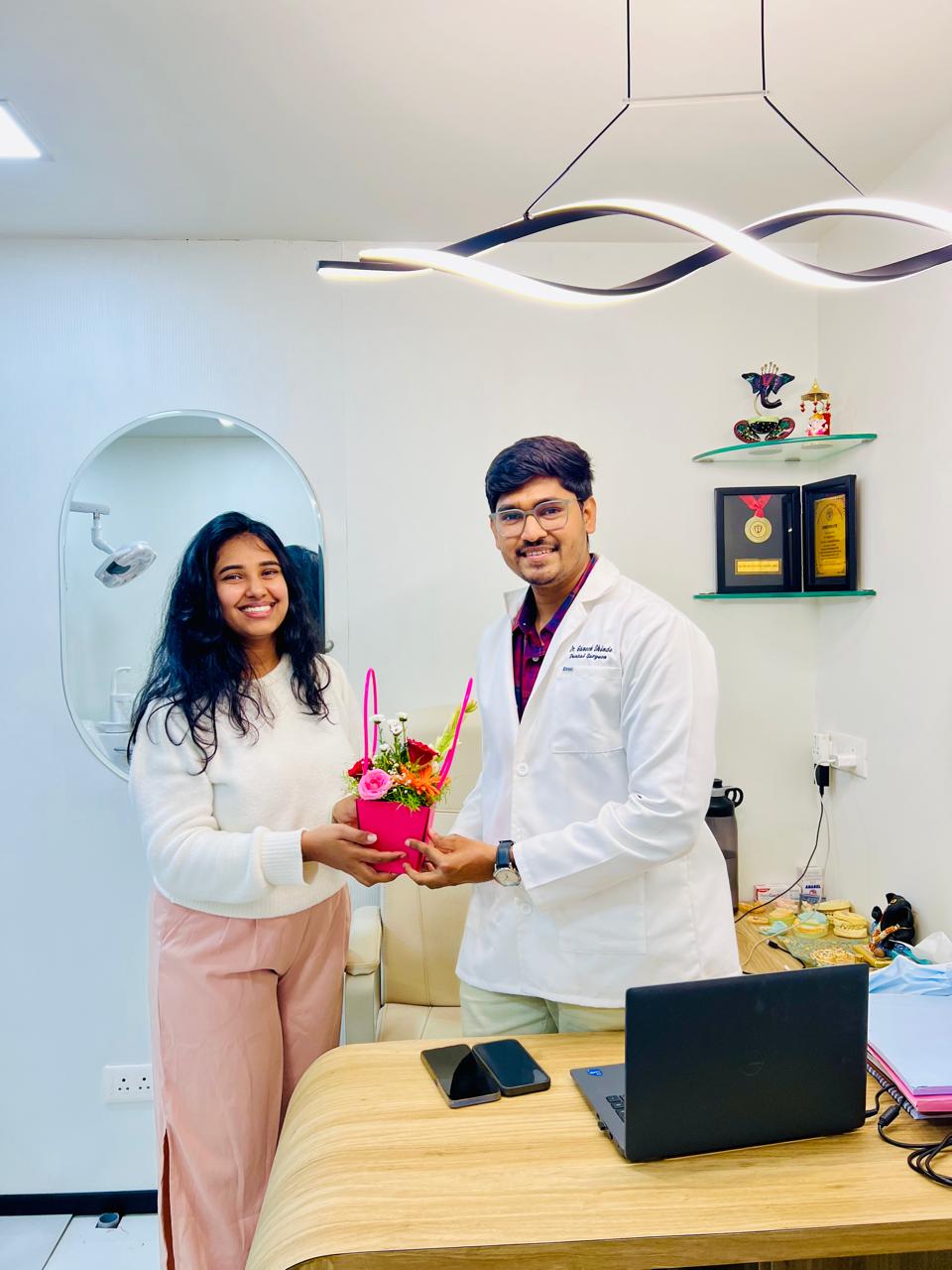 Shravani Deshmukh with client Dr. Ganesh at Dantveda Dent Care
